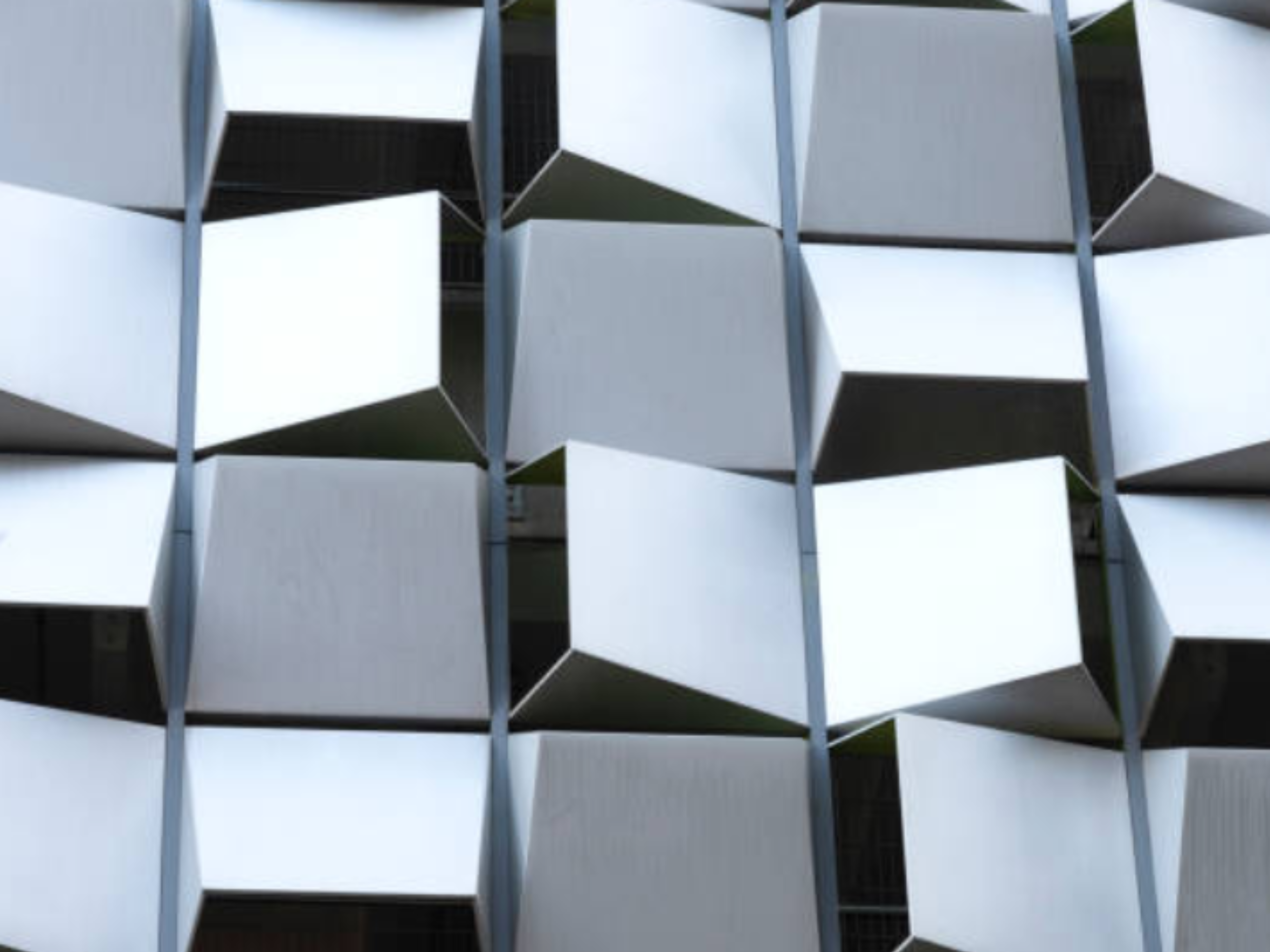 Close up of a Metal Shadowbox facade with angular metal panels creating depth and airflow.