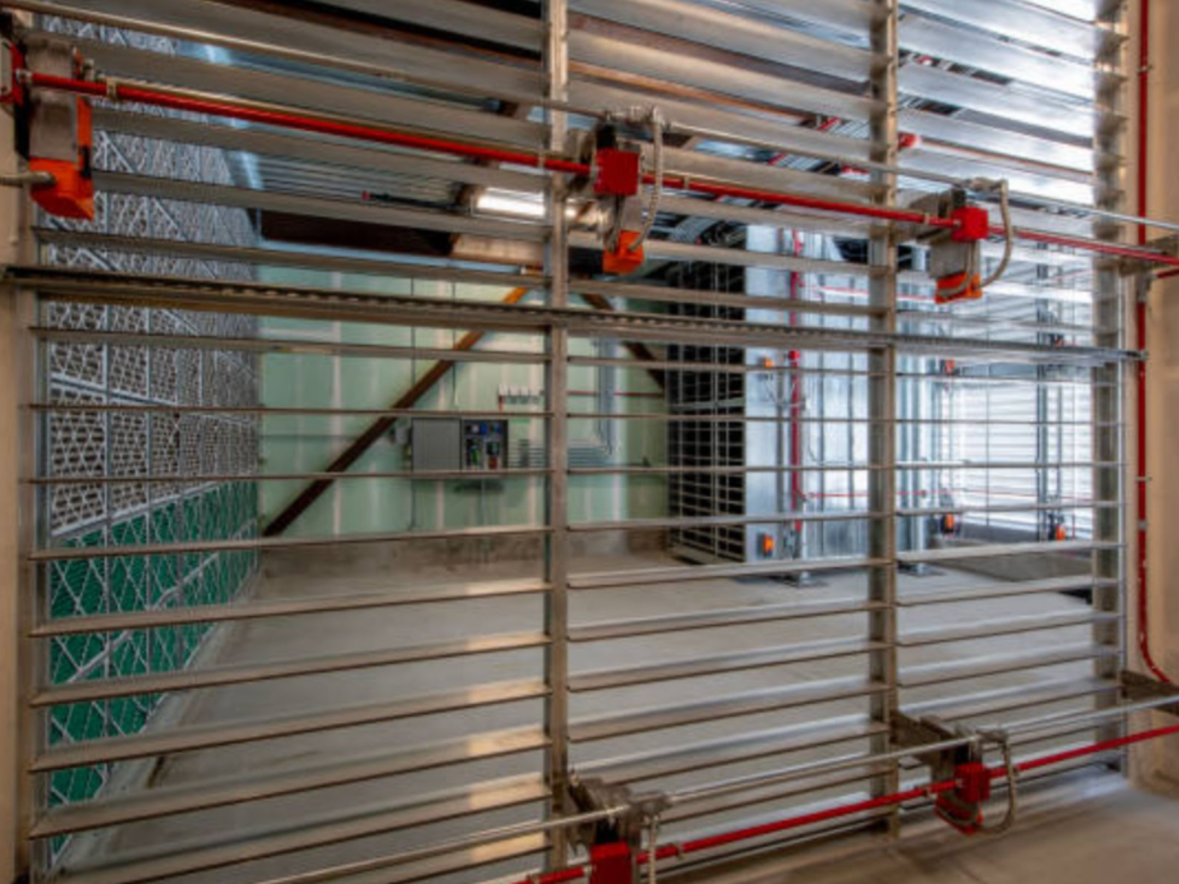 Industrial ventilation system with metal louvers and control panels.